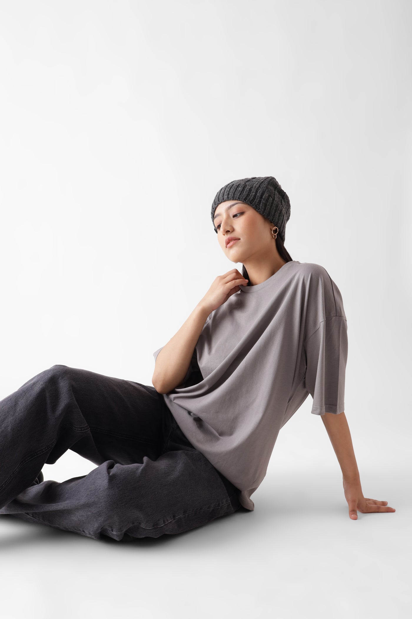 Classic oversized grey tshirt for women - sitting on the floor - unbound crew