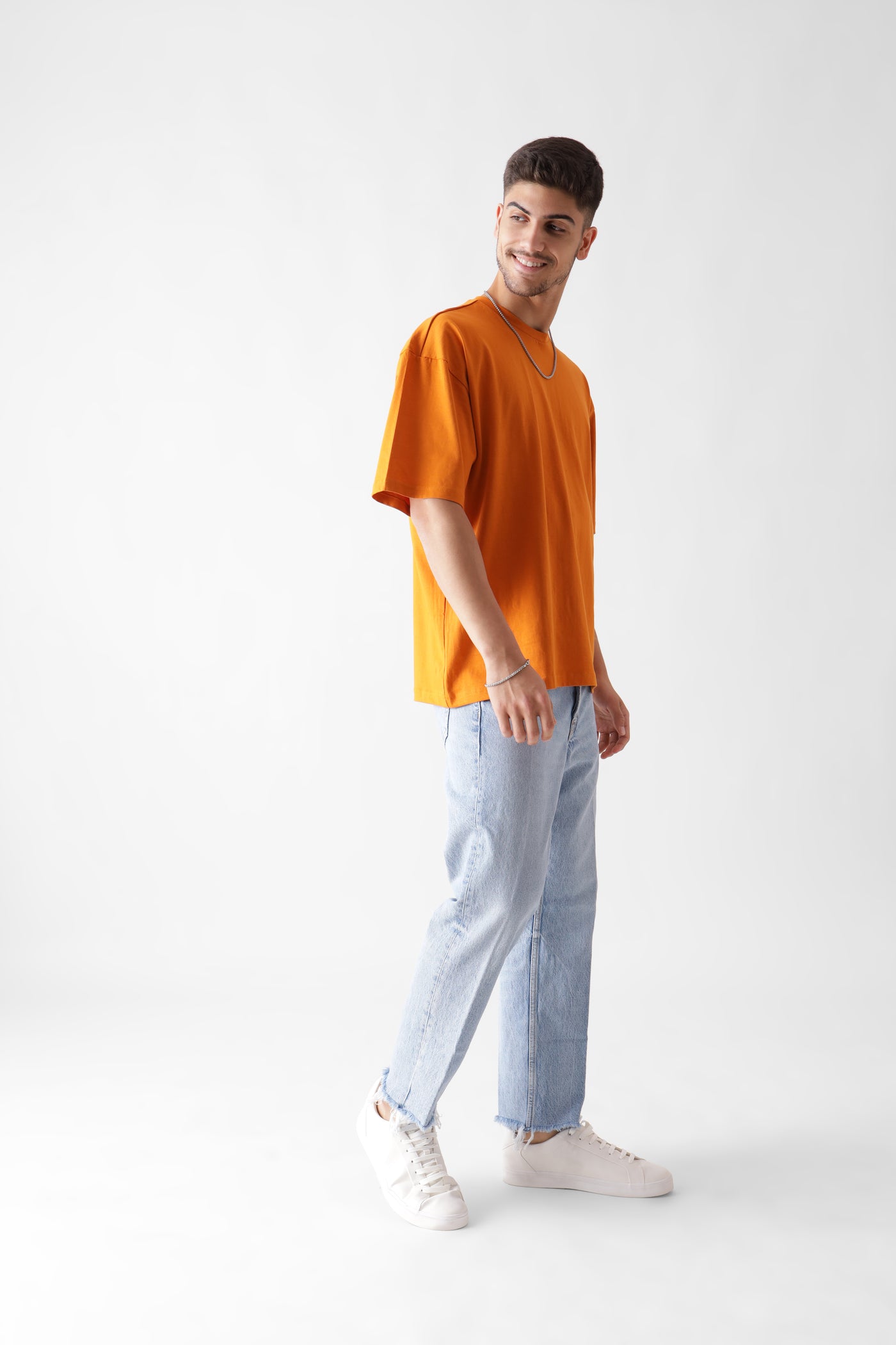 Classic oversized orange tshirt for men - side view full - unbound crew