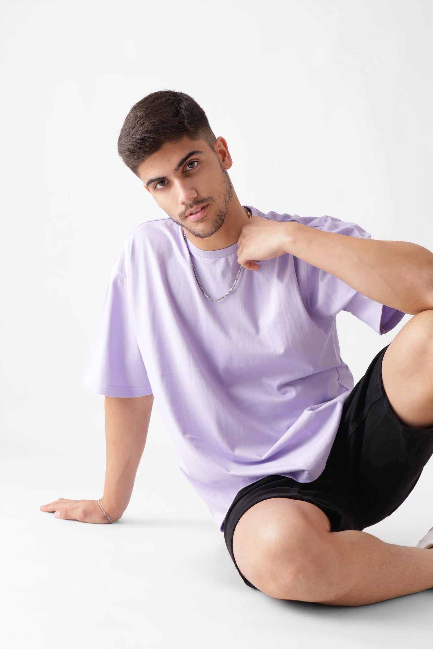 Classic oversized lavender tshirt for men - sitting on the floor - unbound crew