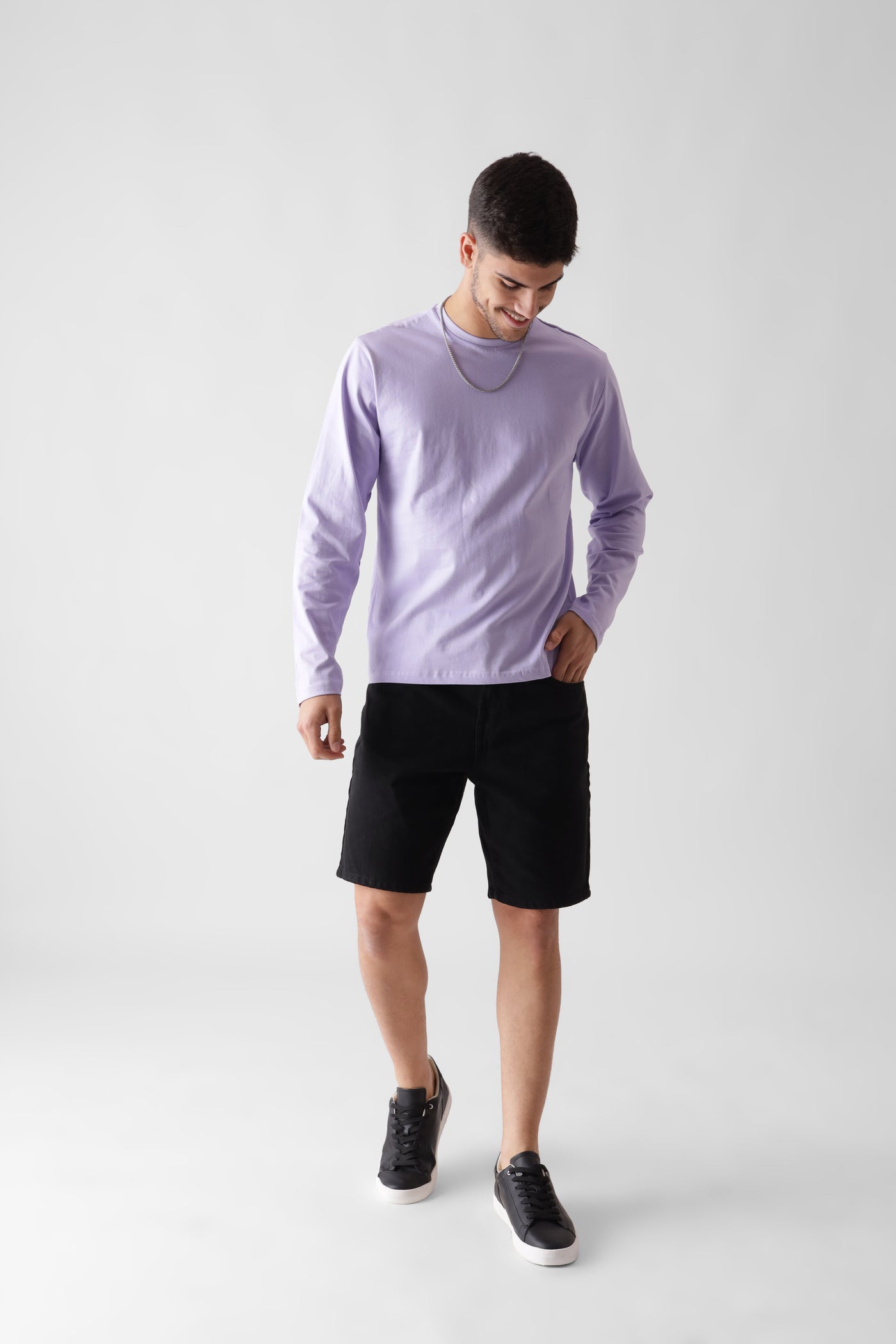 Classic long sleeve lavender tshirt for men - looking down smiling front view - unbound crew