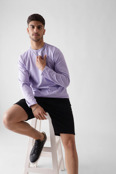 Classic long sleeve lavender tshirt for men - sitting on a wooden chair - unbound crew