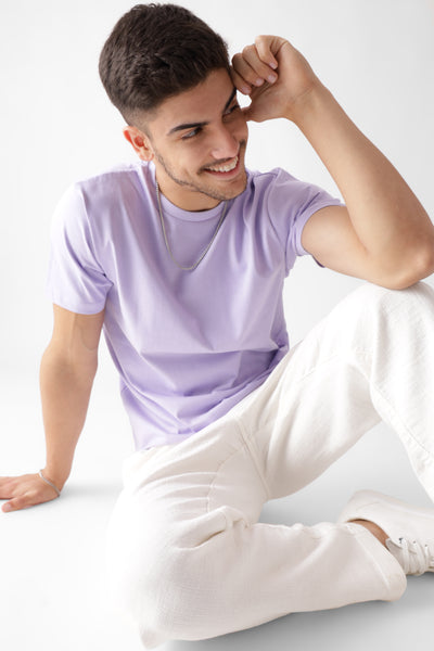 Classic half sleeve lavender tshirt for men - sitting on the floor smiling - unbound crew