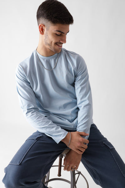 Classic long sleeve ice blue tshirt for men - sitting on the chair - unbound crew