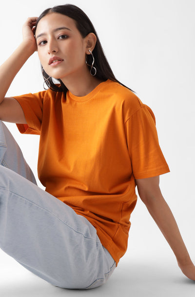 Classic half sleeve orange tshirt for women - sitting on the floor - unbound crew