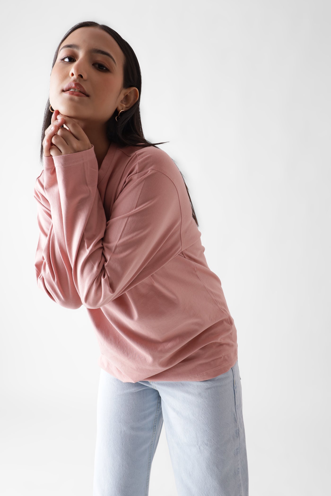 Classic long sleeve dust pink tshirt for women - leaning forward front view - unbound crew